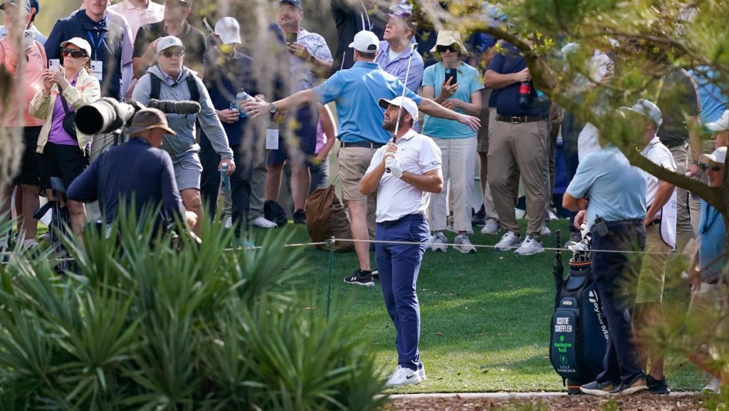 Mar 12, 2026; Ponte Vedra Beach, Florida, USA; Scottie Scheffler plays his approach shot from the trees on the 15th hole during the first round of THE PLAYERS Championship golf tournament.