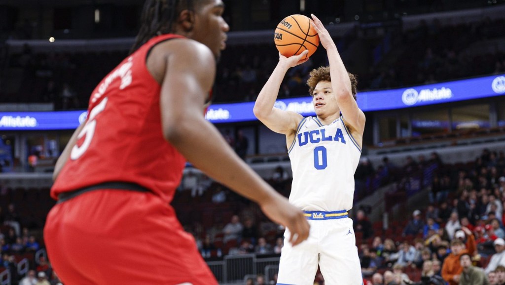 Mar 12, 2026; Chicago, IL, USA; UCLA Bruins guard Trent Perry (0) shoots against the Rutgers Scarlet Knights during the second half at United Center.