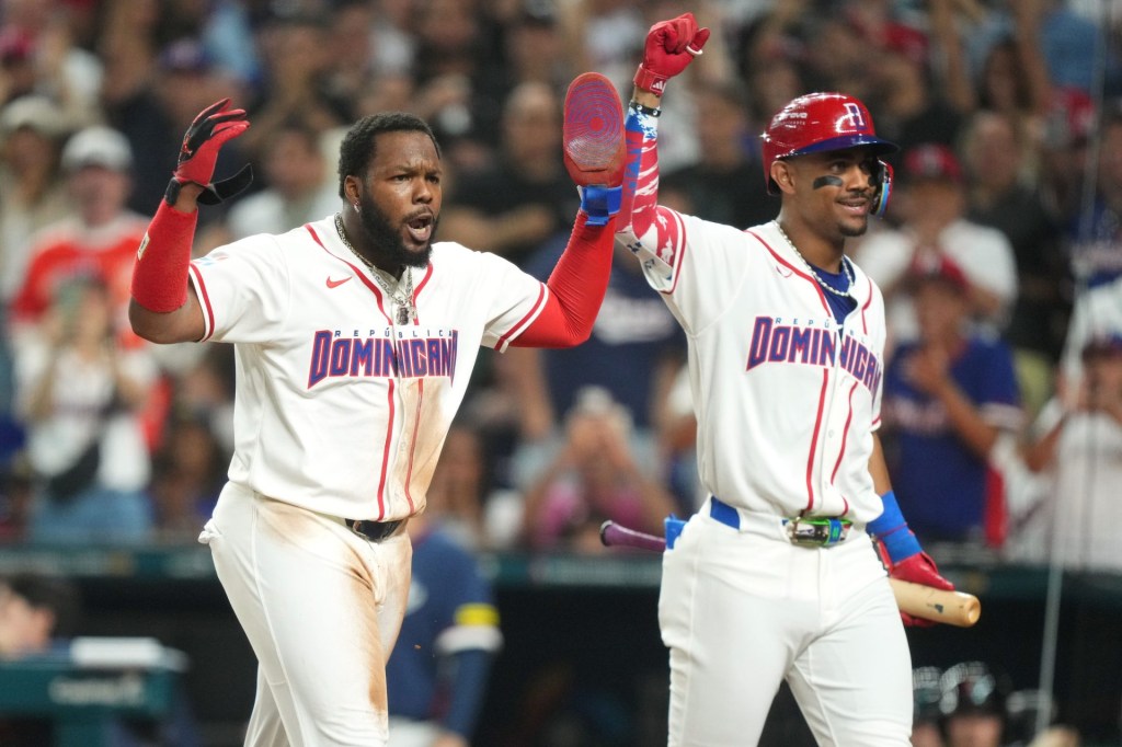 Mar 13, 2026; Miami, FL, United States; Dominican Republic first baseman Vladimir Guerrero Jr., left, and center fielder Julio Rodrguez celebrate scoring a run against the Korea in the second inning during a quarterfinal game of the 2026 World Baseball Classic at loanDepot Park.