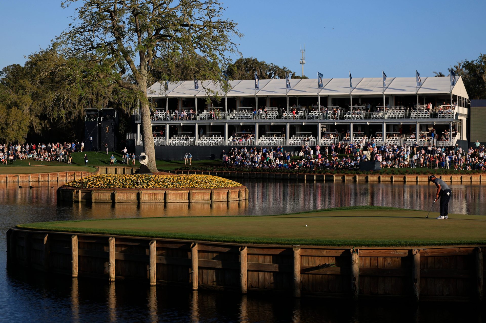 Si Woo Kim putts on the 17th green during the second round of The Players Championship PGA golf tournament at TPC Sawgrass, Friday, March 13, 2026, in Ponte Vedra Beach, Fla.