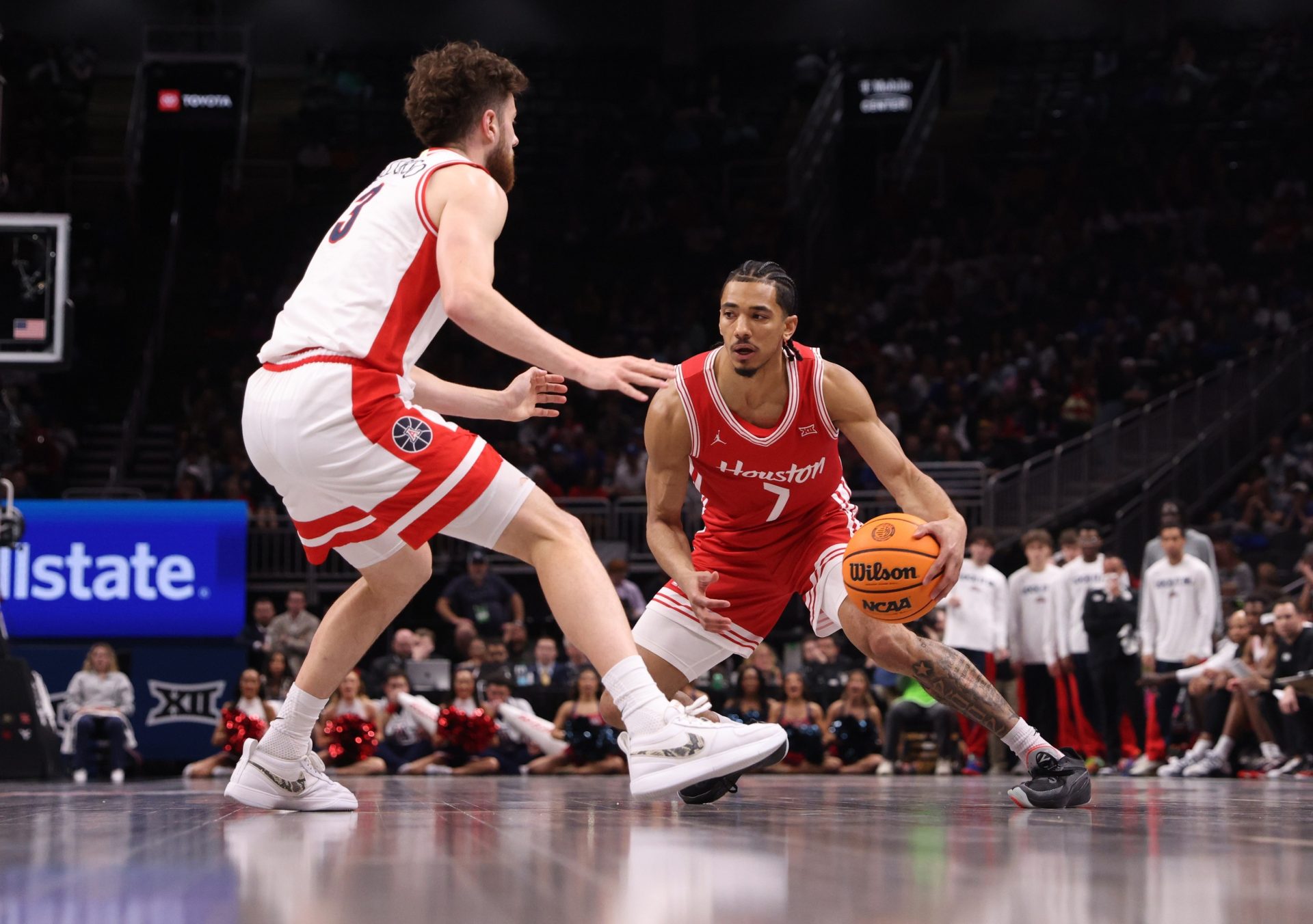 Mar 14, 2026; Kansas City, MO, USA; Houston Cougars guard Milos Uzan (7) drives to the hoop past Arizona Wildcats guard Anthony Dell'orso (3) during the second half during the men's Big 12 Conference Tournament Championship at T-Mobile Center.