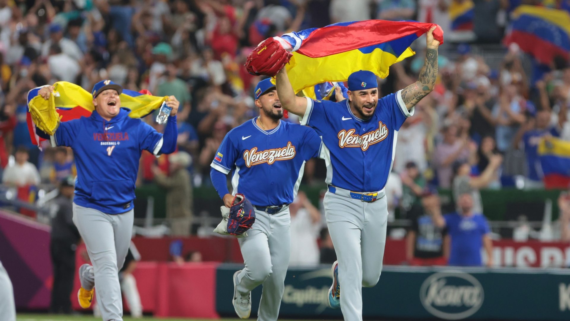 Mar 16, 2026; Miami, FL, United States; Venezuela pitcher José Buttó (70) and teammates celebrate after defeating Italy in a semifinal game of the 2026 World Baseball Classic at loanDepot Park.