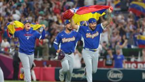 Mar 16, 2026; Miami, FL, United States; Venezuela pitcher José Buttó (70) and teammates celebrate after defeating Italy in a semifinal game of the 2026 World Baseball Classic at loanDepot Park.