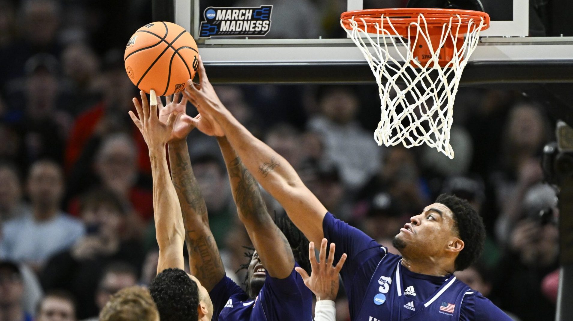 Mar 19, 2026; Portland, OR, USA; High Point Panthers forward Owen Aquino (8) blocks the shot of Wisconsin Badgers guard Nick Boyd (2) during the second half of a first round game of the men's 2026 NCAA Tournament at Moda Center