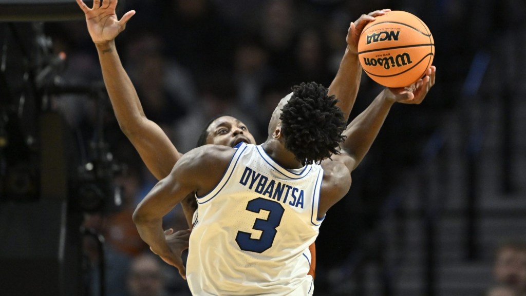 Mar 19, 2026; Portland, OR, USA; Texas Longhorns guard Tramon Mark (12) blocks BYU Cougars forward AJ Dybantsa (3) in the second half during a first round game of the men's 2026 NCAA Tournament at Moda Center. Mandatory Credit: Craig Strobeck-Imagn Images