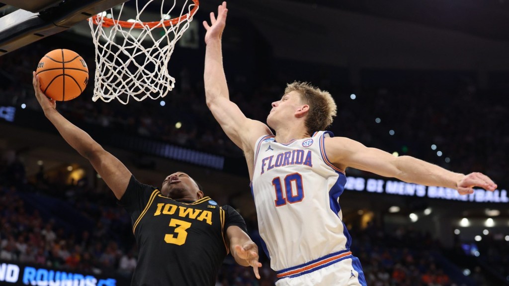 Mar 22, 2026; Tampa, FL, USA; Iowa Hawkeyes forward Cam Manyawu (3) shoots past Florida Gators forward Thomas Haugh (10) in the second half during a second round game of the men's 2026 NCAA Tournament at Benchmark International Arena. Mandatory Credit: Nathan Ray Seebeck-Imagn Images