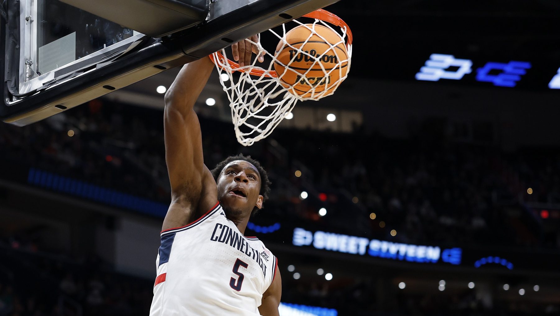 Mar 27, 2026; Washington, DC, USA;UConn Huskies forward Tarris Reed Jr. (5) dunks the ball against the Michigan State Spartans in the second half during a Sweet Sixteen game of the East Regional of the men's 2026 NCAA Tournament at Capital One Arena