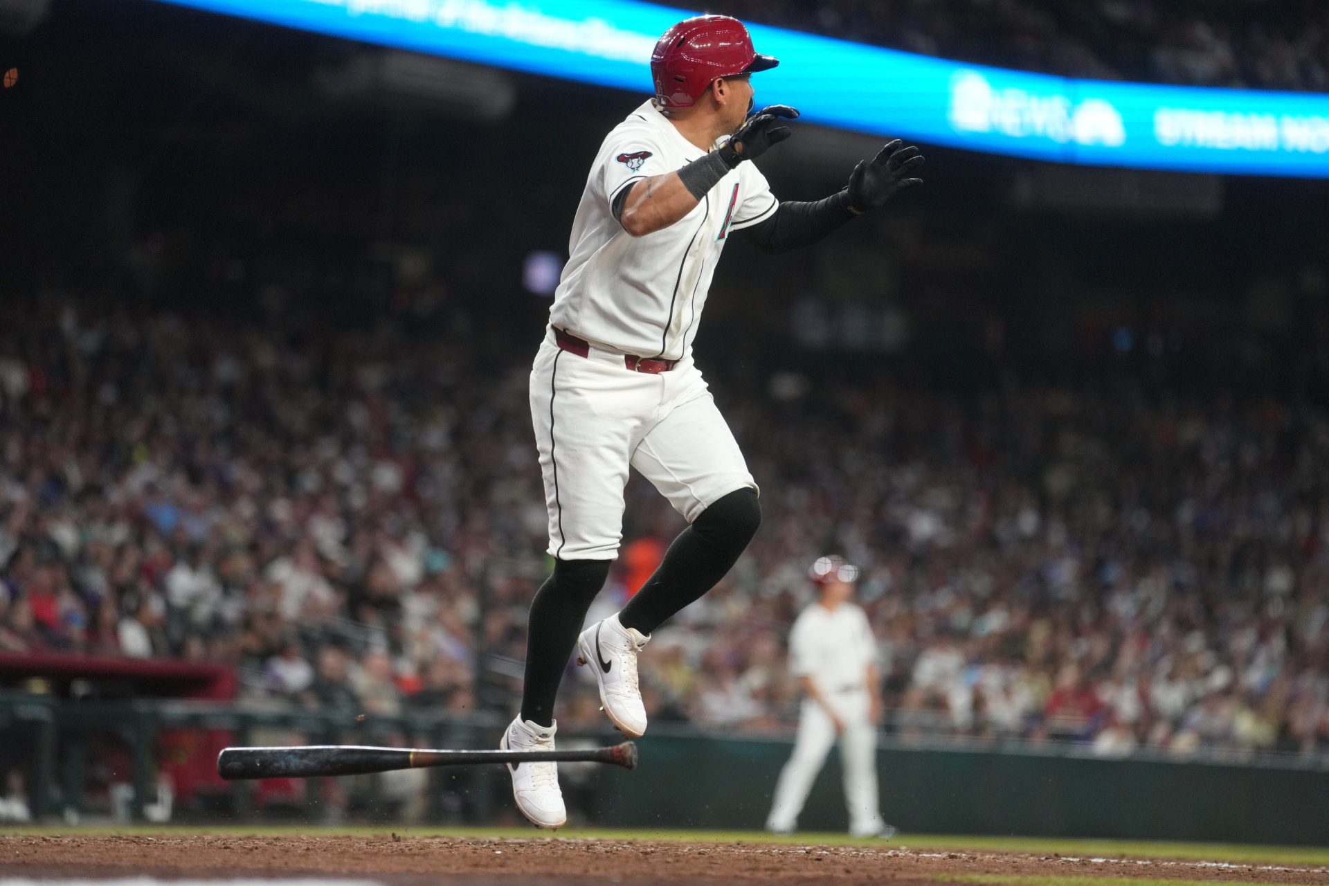 Arizona Diamondbacks' Ildemaro Vargas (6) watches his solo home run sail over the fence against the Detroit Tigers at Chase Field on March 30, 2026.