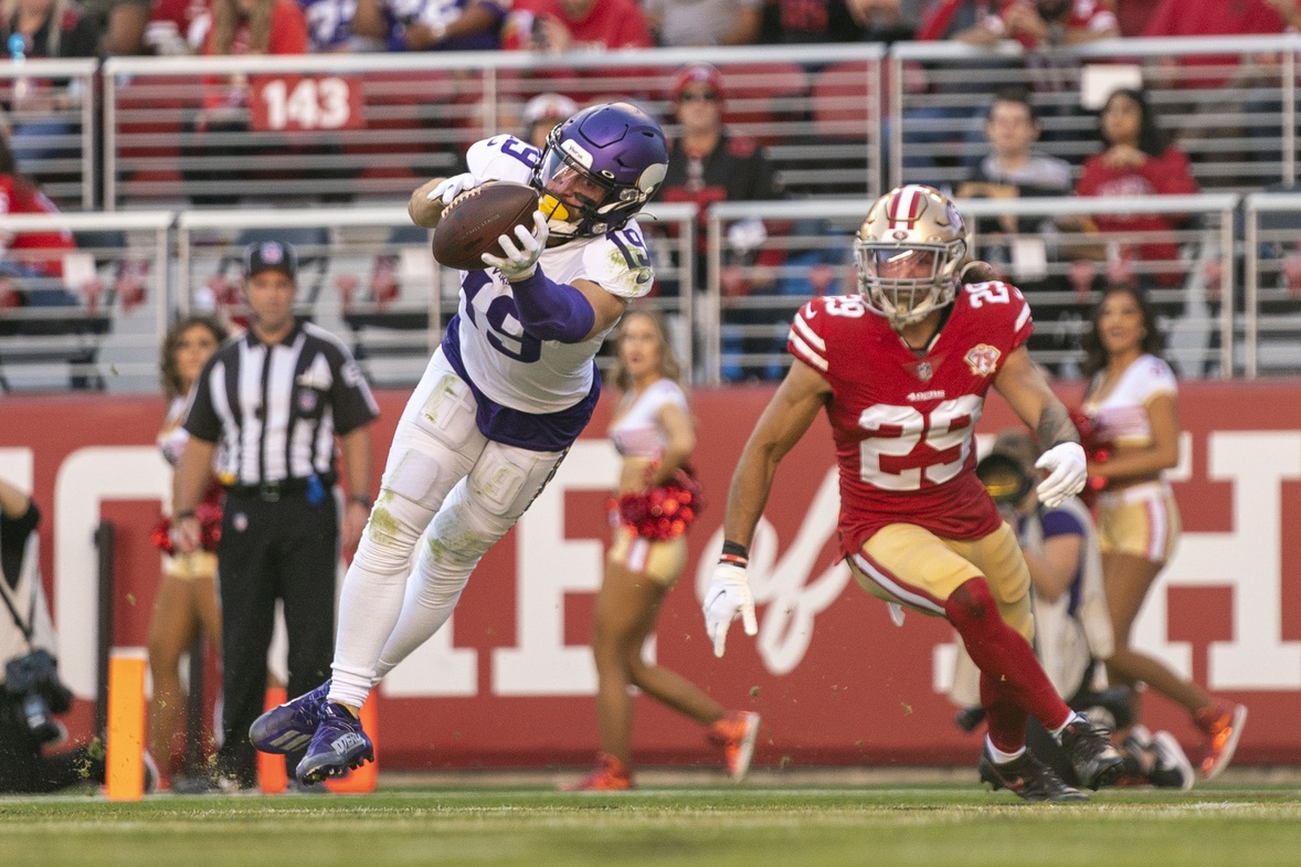 November 28, 2021; Santa Clara, California, USA; Minnesota Vikings wide receiver Adam Thielen (19) catches a touchdown against San Francisco 49ers safety Talanoa Hufanga (29) during the second quarter at Levi's Stadium.
