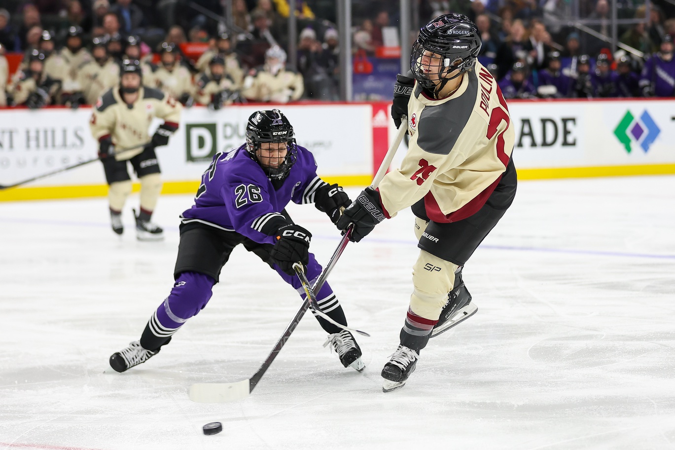 Jan 6, 2024; St. Paul, Minnesota, USA; Montreal forward Marie-Philip Poulin (29) shoots as Minnesota forward Kendall Coyne (26) defends during the second period in a PWHL ice hockey game at XCel Energy Center.