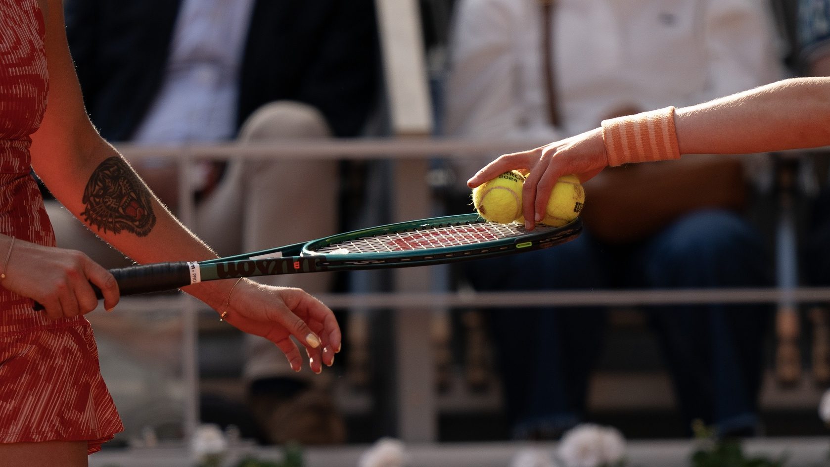 Jun 5, 2024; Paris, France; A ball person puts the ball on the racket of Aryna Sabalenka during her match against Mirra Andreeva on day 11 of Roland Garros at Stade Roland Garros