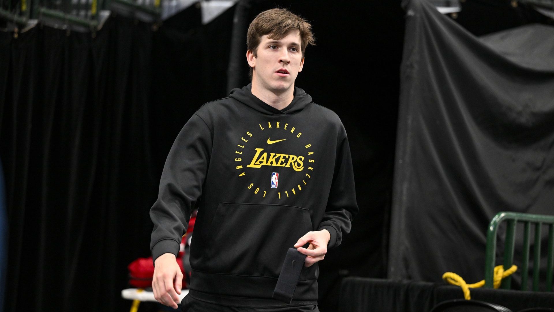 Apr 9, 2025; Dallas, Texas, USA; Los Angeles Lakers guard Austin Reaves (15) walks on to the court before the game between the Dallas Mavericks and the Los Angeles Lakers during the first quarter at the American Airlines Center