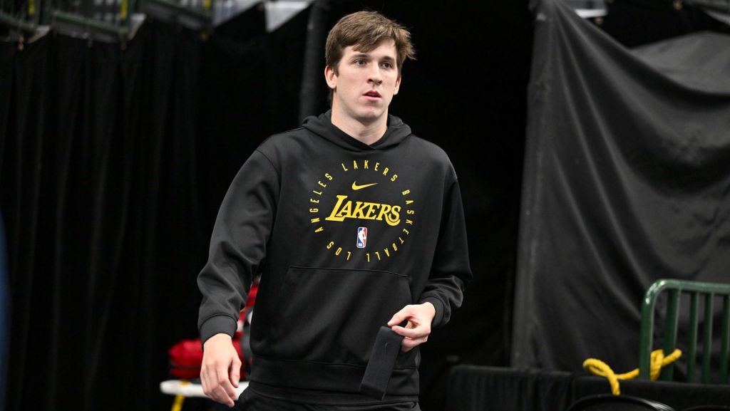 Apr 9, 2025; Dallas, Texas, USA; Los Angeles Lakers guard Austin Reaves (15) walks on to the court before the game between the Dallas Mavericks and the Los Angeles Lakers during the first quarter at the American Airlines Center