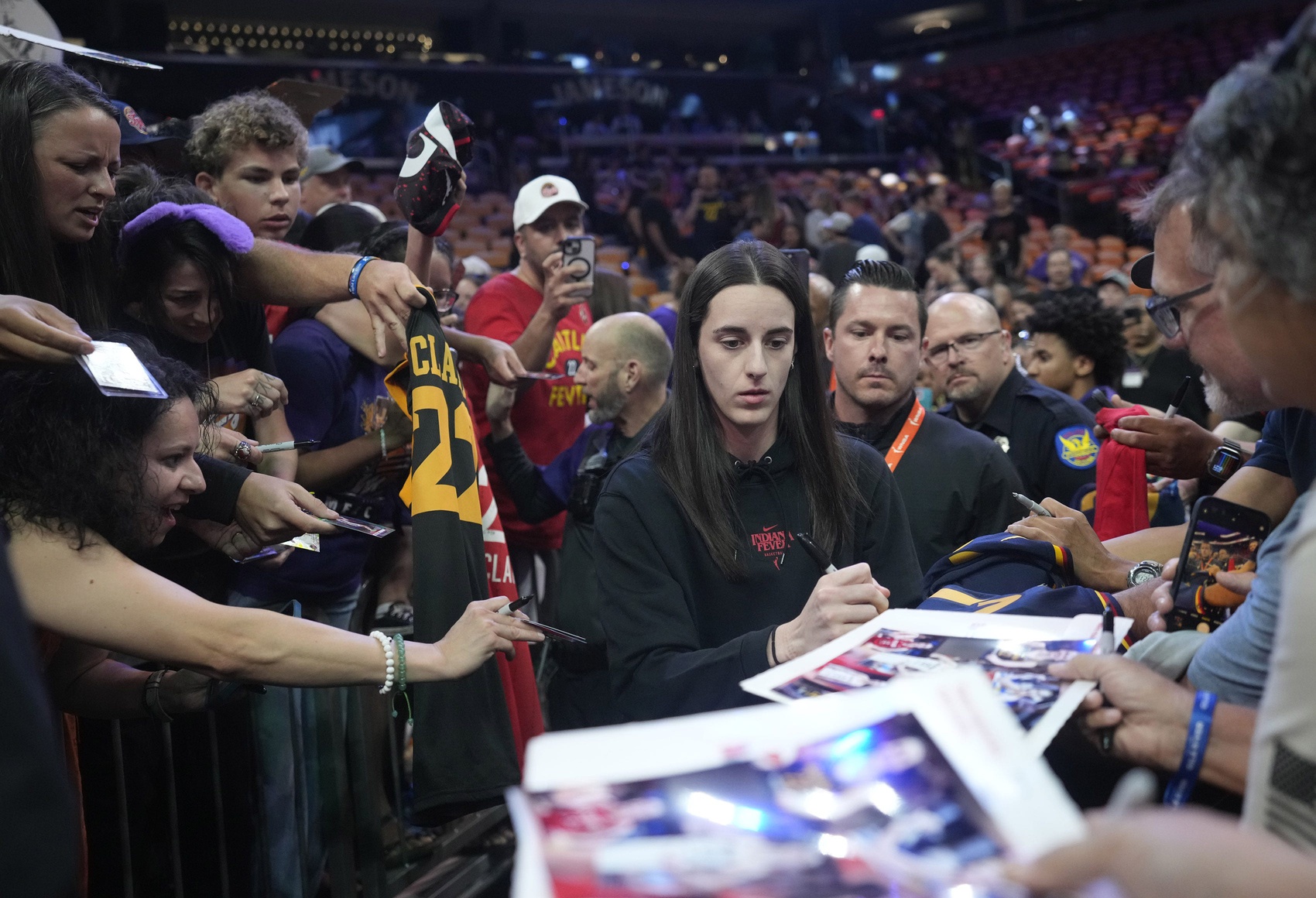 Indiana Fever guard Caitlin Clark signs autographs before a game against the Phoenix Mercury at PHX Arena on Sept. 2, 2025.