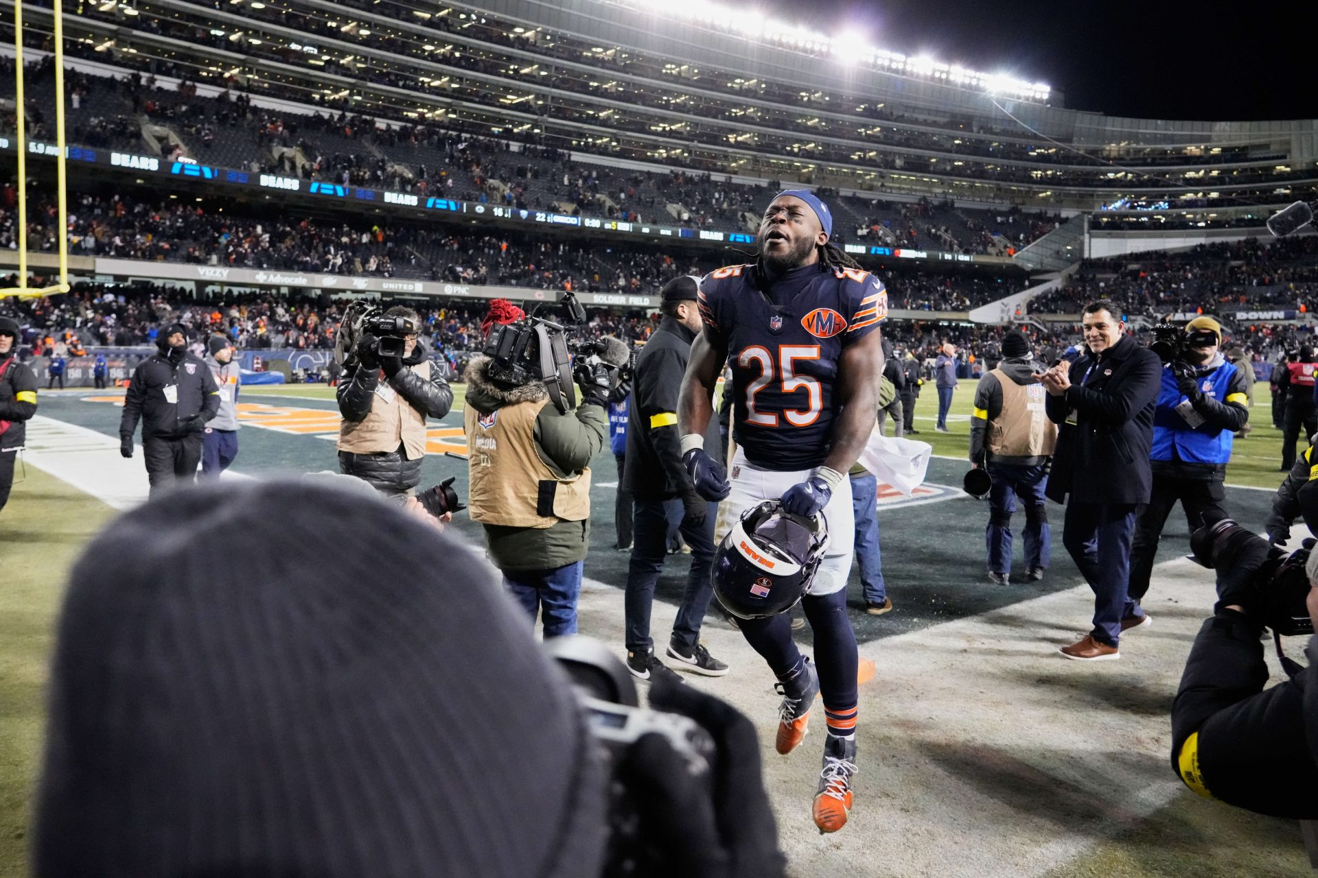 Dec 20, 2025; Chicago, Illinois, USA; Chicago Bears running back Kyle Monangai (25) runs off the field and reacts after Chicago defeated the Green Bay Packers in overtime at Soldier Field.