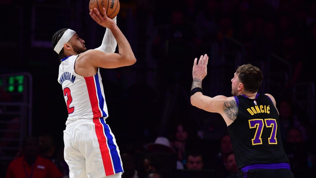 Dec 30, 2025; Los Angeles, California, USA; Detroit Pistons guard Cade Cunningham (2) shoots against Los Angeles Lakers guard Luka Doncic (77) during the second half at Crypto.com Arena. Mandatory Credit: Gary A. Vasquez-Imagn Images