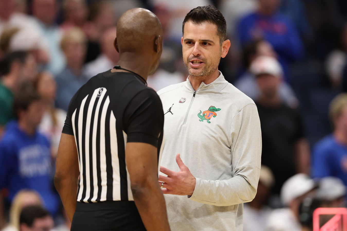 Mar 22, 2026; Tampa, FL, USA; Florida Gators head coach Todd Golden talks to a referee against the Iowa Hawkeyes in the first half during a second round game of the men's 2026 NCAA Tournament at Benchmark International Arena.