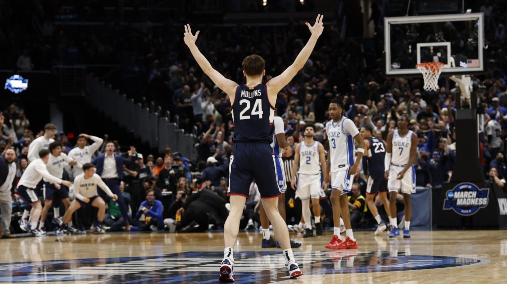 Mar 29, 2026; Washington, DC, USA; UConn Huskies guard Braylon Mullins (24) celebrates after making the game-winning three-point basket against the Duke Blue Devils in the second half during an Elite Eight game of the East Regional of the men's 2026 NCAA Tournament at Capital One Arena