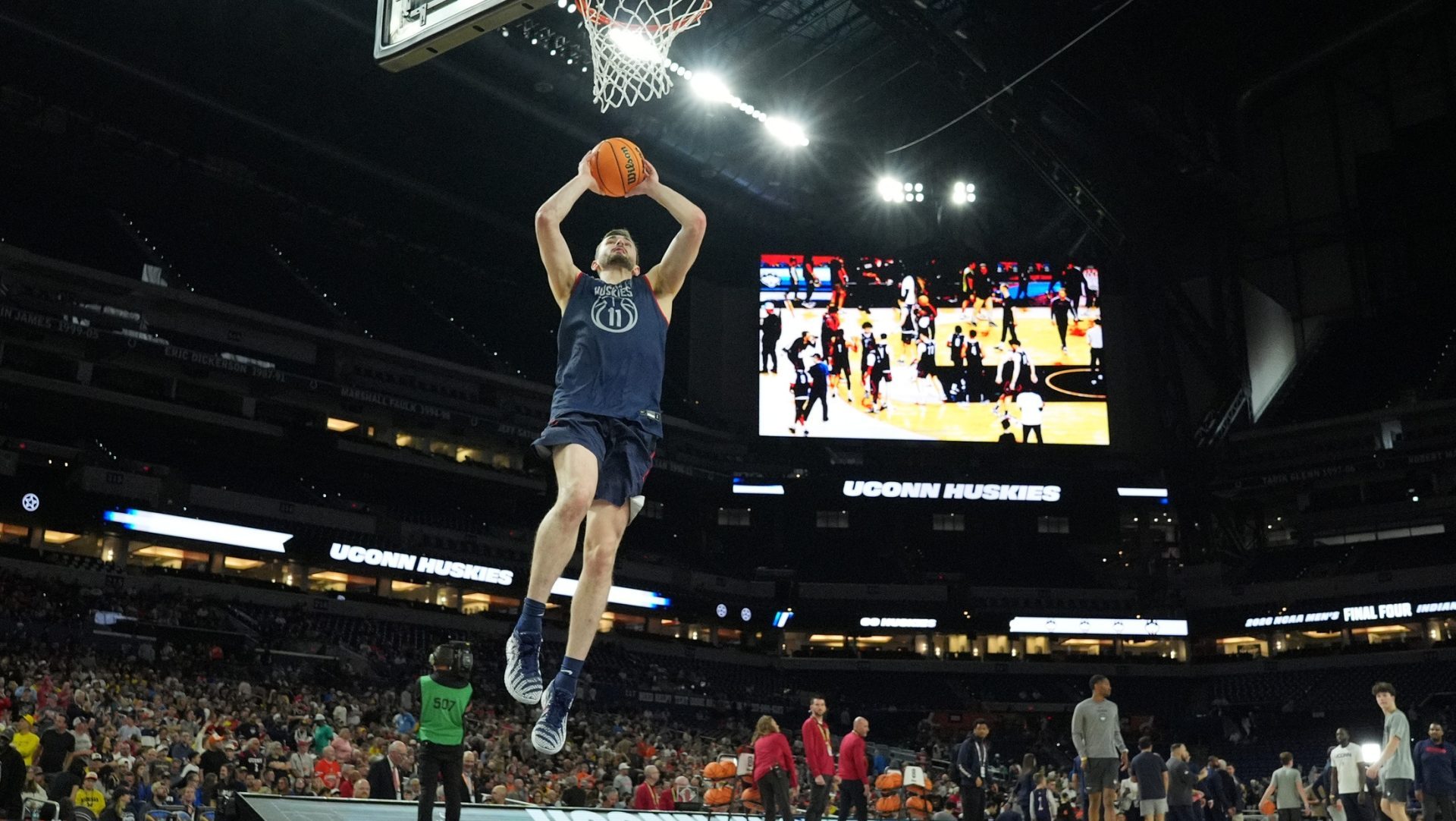 Apr 3, 2026; Indianapolis, IN, USA; UConn Huskies forward Alex Karaban (11) dunks during a practice session ahead of the Final Four of the men's 2026 NCAA Tournament at Lucas Oil Stadium. Mandatory Credit: Robert Deutsch-Imagn Images