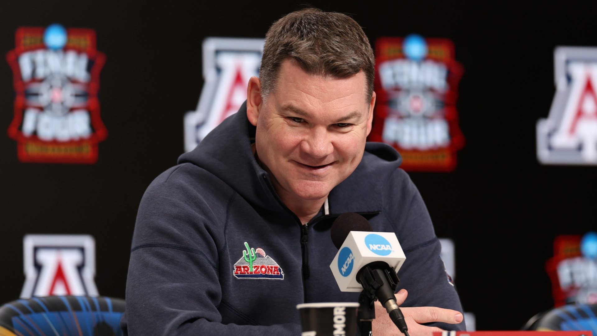 Apr 3, 2026; Indianapolis, IN, USA; Arizona Wildcats head coach Tommy Lloyd speaks during a press conference ahead of the Final Four of the men's 2026 NCAA Tournament at Lucas Oil Stadium.