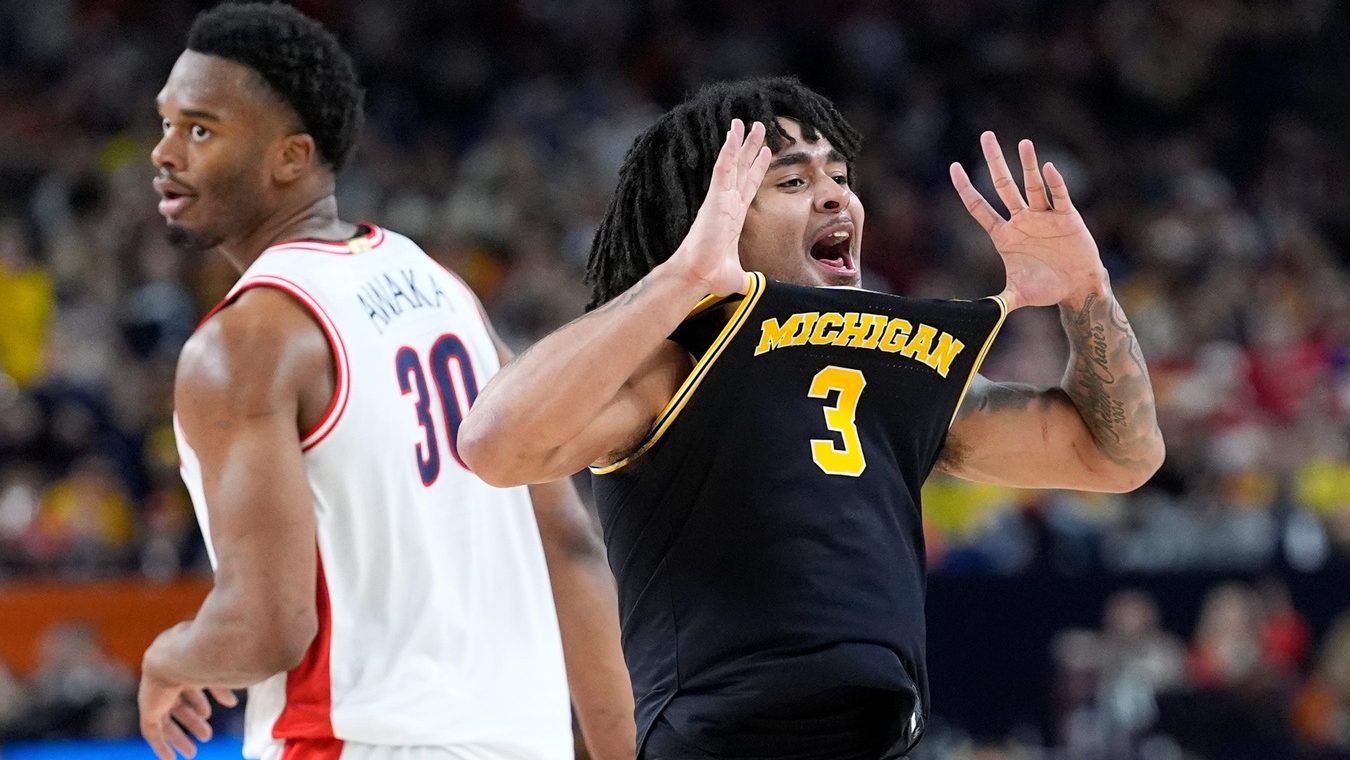 Michigan guard Elliot Cadeau (3) celebrates a play in the second half of their Final Four game against Arizona at Lucas Oil Stadium in Indianapolis on Saturday, April 4, 2026.