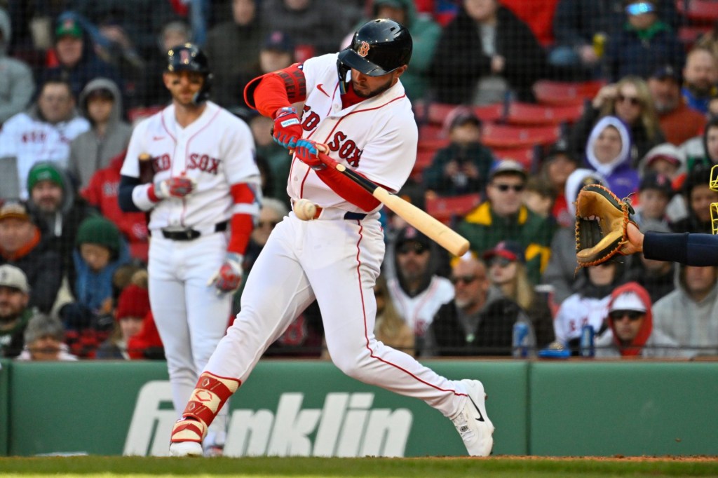 Apr 8, 2026; Boston, Massachusetts, USA; Boston Red Sox right fielder Wilyer Abreu (52) hits a single against the Milwaukee Brewers during the seventh inning at Fenway Park.