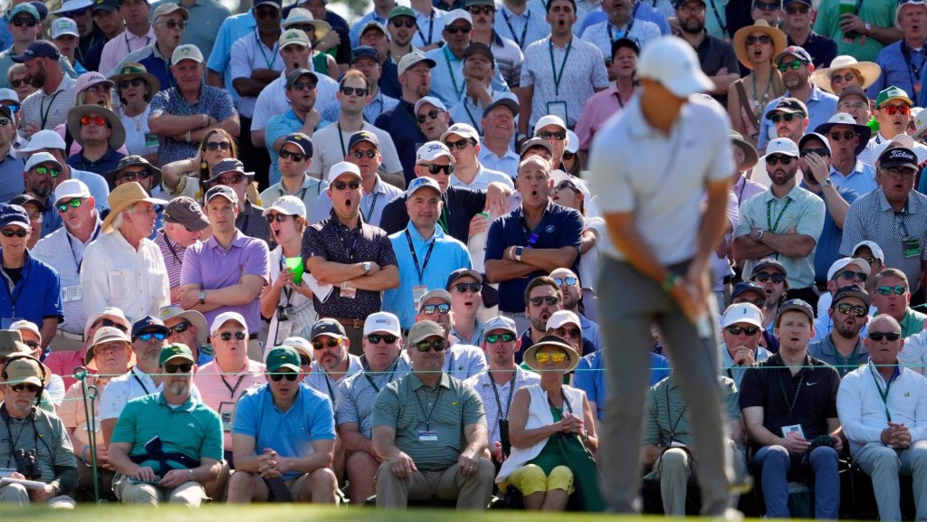 Apr 10, 2026; Augusta, Georgia, USA; Patrons react after Rory McIlroy's first putt on the 10th green during the second round of the Masters Tournament at Augusta National Golf Club. Mandatory Credit: Katie Goodale-Imagn Images
