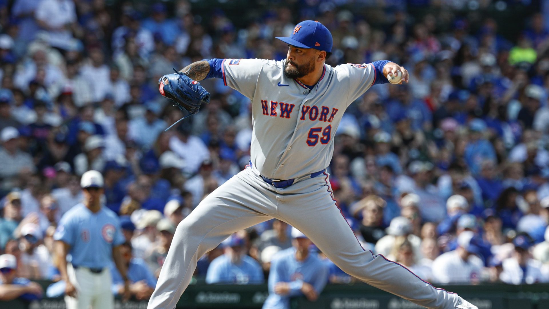 Apr 17, 2026; Chicago, Illinois, USA; New York Mets relief pitcher Sean Manaea (59) delivers a pitch against the Chicago Cubs during the fifth inning at Wrigley Field.