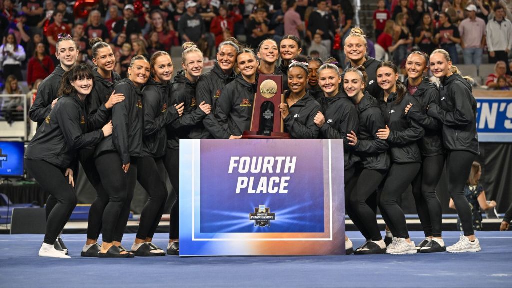 Apr 18, 2026; Fort Worth, TX, USA; The University of Minnesota gymnastics team poses with their trophy after finishing in fourth place in the 2026 NCAA Women’s Gymnastics National Championships at Dickies Arena. Mandatory Credit: Jerome Miron-Imagn Images