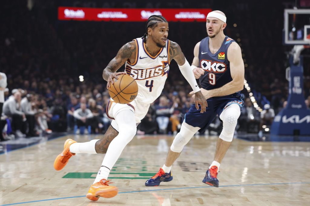 Apr 22, 2026; Oklahoma City, Oklahoma, USA; Phoenix Suns guard Jalen Green (4) drives around Oklahoma City Thunder guard Alex Caruso (9) in the first half during game two of the first round of the 2026 NBA Playoffs at Paycom Center.