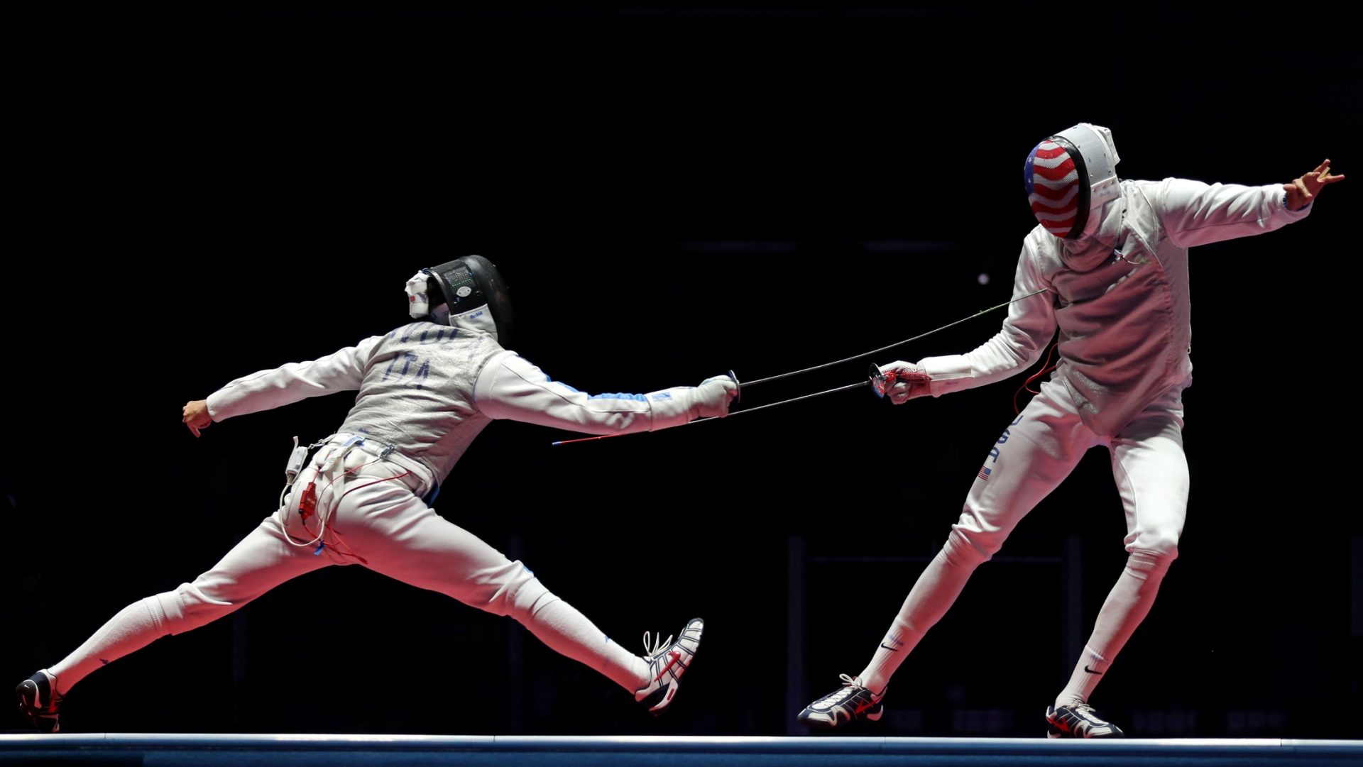 Aug 12, 2016; Rio de Janeiro, Brazil; Giorgio Avola (ITA) fences Miles Chamley-Watson (USA) during the men's team foil bronze medal match in the Rio 2016 Summer Olympic Games at Carioca Arena 3.