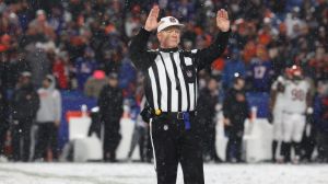 NFL Referee Carl Cheffers signals a penalty during the Buffalo Bills game against the Cincinnati Bengals at home in Orchard Park on Jan. 22.