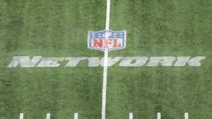 Mar 4, 2023; Indianapolis, IN, USA; The NFL Network logo on the field at Lucas Oil Stadium. Mandatory Credit: Kirby Lee-USA TODAY Sports