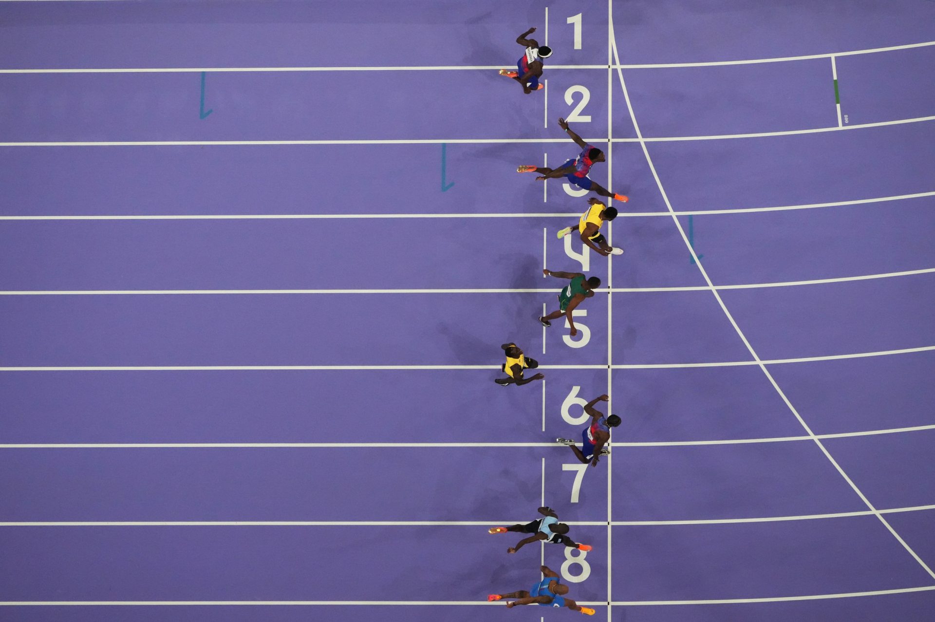 Aug 4, 2024; Paris, FRANCE; Noah Lyles (USA) defeats Kishane Thompson (JAM) and Fred Kerley (USA) to win the men's 100m final during the Paris 2024 Olympic Summer Games at Stade de France.