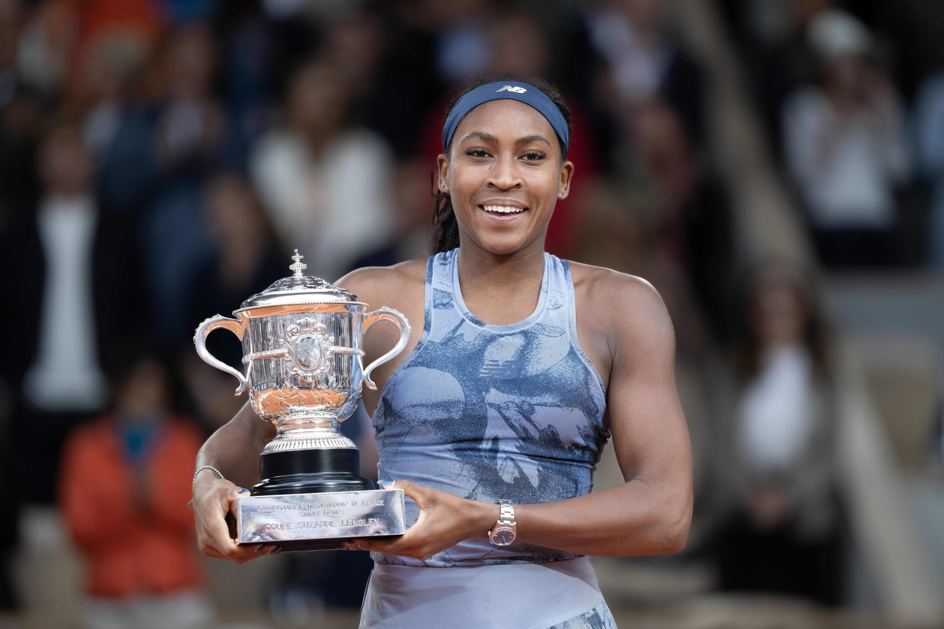 Jun 7, 2025; Paris, FR; Coco Gauff of the United States poses with the trophy after winning the women's singles final against Aryna Sabalenka on day 14 at Roland Garros Stadium.