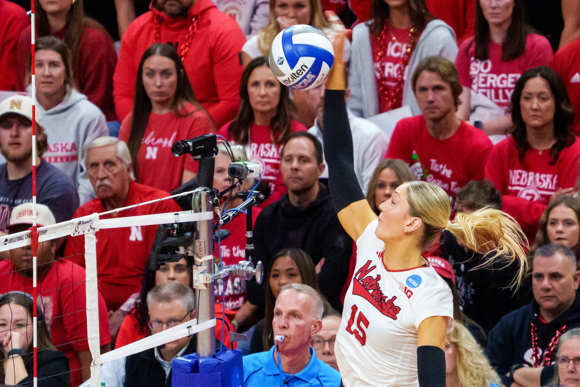 Dec 14, 2025; Lincoln, NE, USA; Nebraska Cornhuskers middle blocker Andi Jackson (15) attacks against the Texas A&M Aggies during the fourth set at Bob Devaney Sports Center.