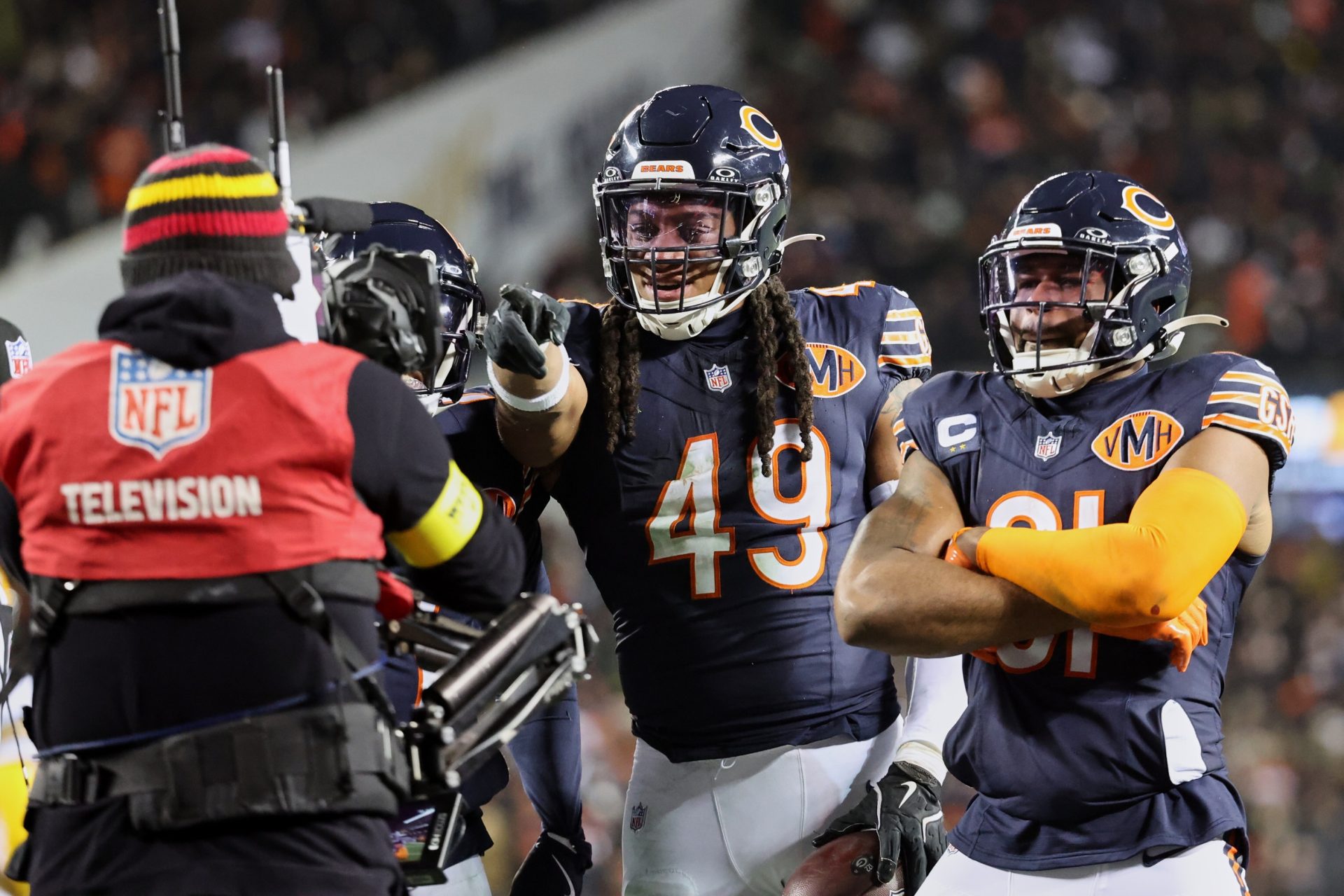 Dec 20, 2025; Chicago, Illinois, USA; Chicago Bears linebacker Tremaine Edmunds (49) poses for a television camera with safety Kevin Byard III (31) after recovering a fumble against the Green Bay Packers during the third quarter at Soldier Field.