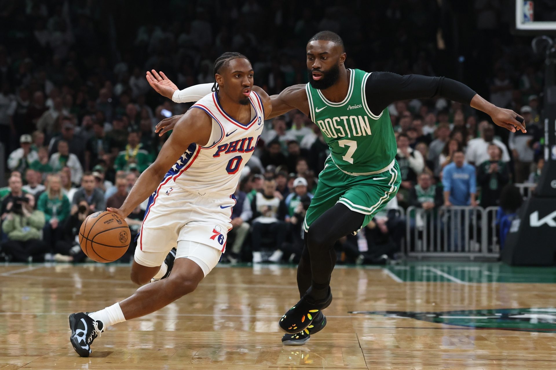 May 2, 2026; Boston, Massachusetts, USA; Philadelphia 76ers guard Tyrese Maxey (0) drives past Boston Celtics guard Jaylen Brown (7) during the first quarter of game seven of the first round of the 2026 NBA Playoffs at TD Garden.