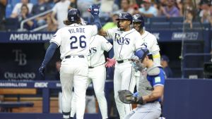 May 4, 2026; St. Petersburg, Florida, USA; Tampa Bay Rays left fielder Chandler Simpson (14) greets right fielder Ryan Vilade (26) at home plate after hitting a three-run home run against the Toronto Blue Jays in the first inning at Tropicana Field.