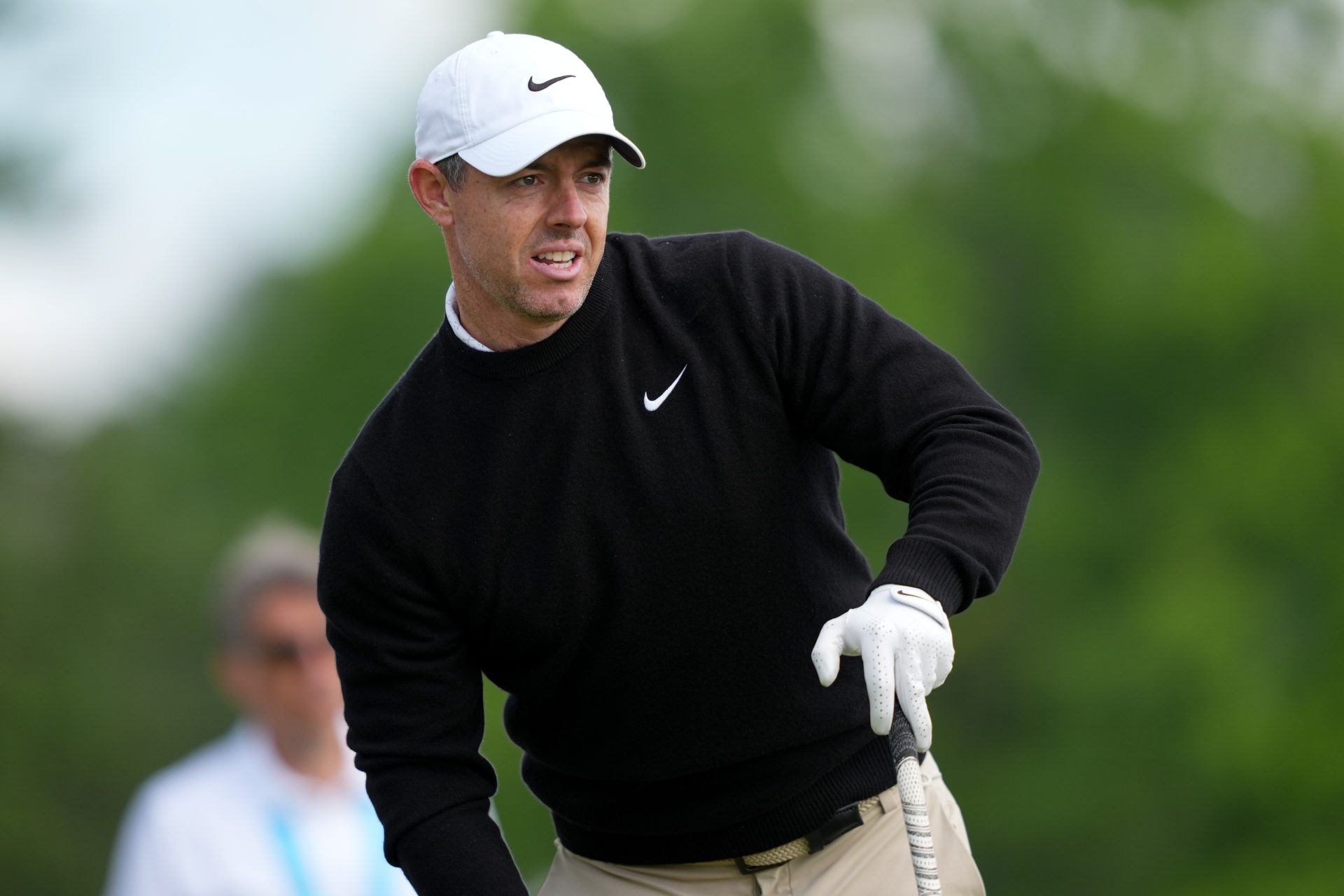 May 14, 2026; Newtown Square, Pennsylvania, USA; Rory McIlroy watches his shot from the 15th tee during the first round of the PGA Championship golf tournament at Aronimink Golf Club.