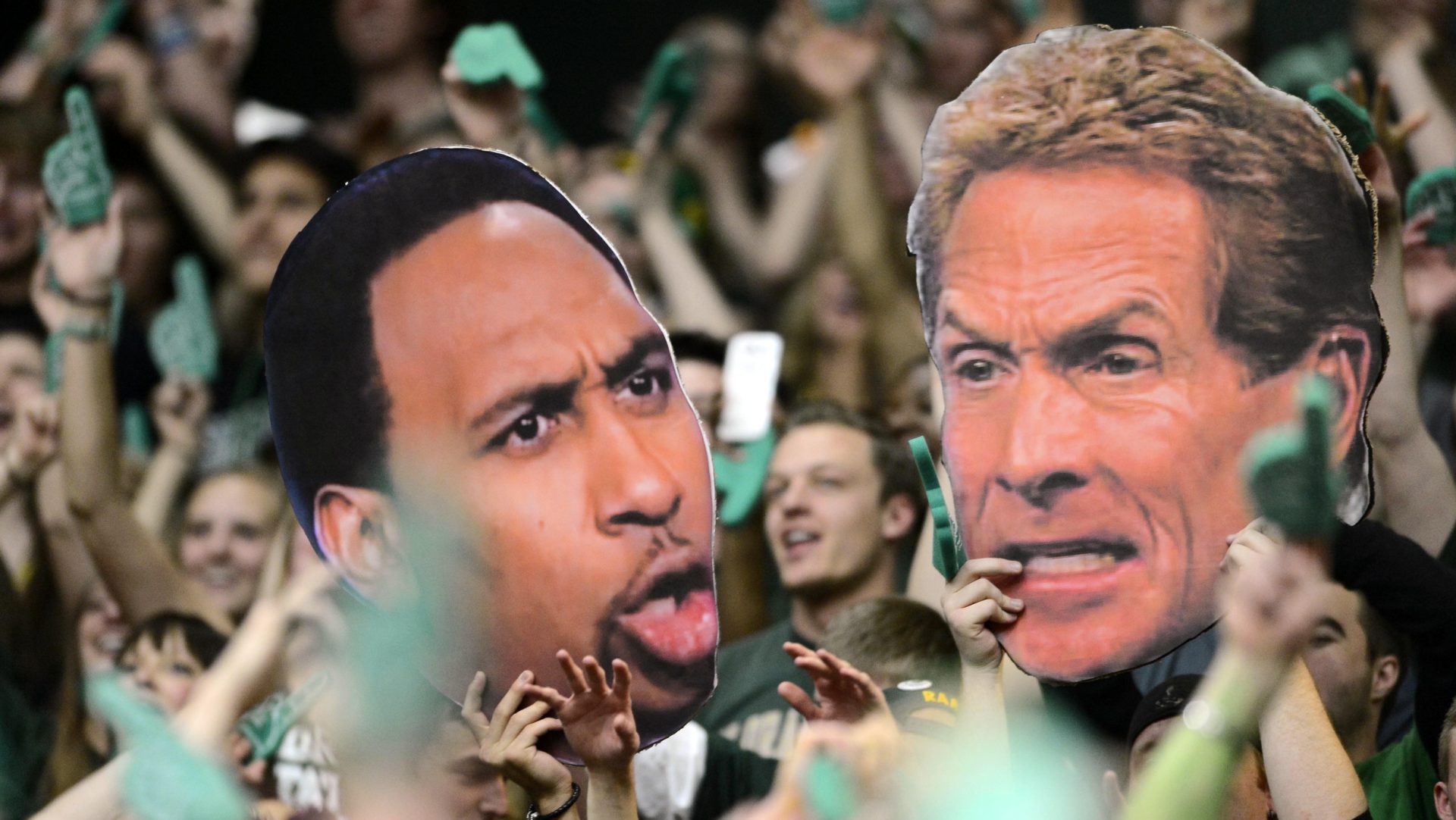 Feb 23, 2013; Fort Collins, CO, USA; Colorado State Rams fans hold large cut outs of ESPN television personality Stephen A. Smith (left) and Skip Bayless (right) during the game against the New Mexico Lobos at Moby Arena. The Lobos defeated the Rams 91-82. Mandatory Credit: Ron Chenoy-USA TODAY Sports