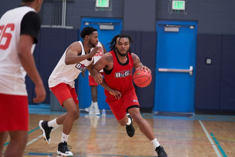 Mar 19, 2022; Scottsdale, AZ, United States; Larry Smith (45) defends while Carlos Johnson (11) drives toward the basket at Victorium. Basketball Big3 Tryouts
