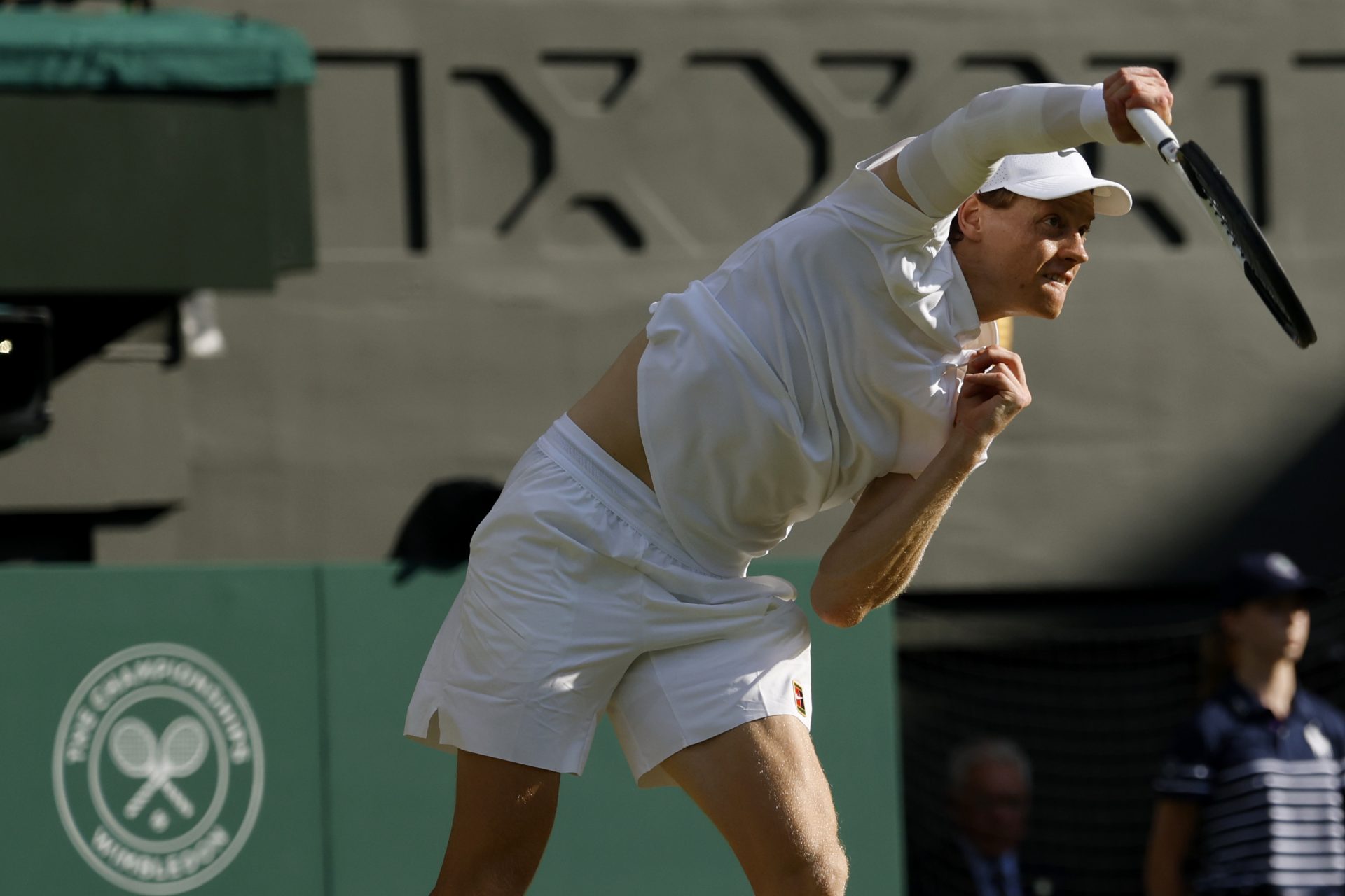 Jul 13, 2025; Wimbledon, United Kingdom; Jannik Sinner (ITA) serves against Carlos Alcaraz (ESP)(not pictured) in the gentlemen's' singles final of The Championships Wimbledon 2025 at All England Lawn Tennis and Croquet Club.