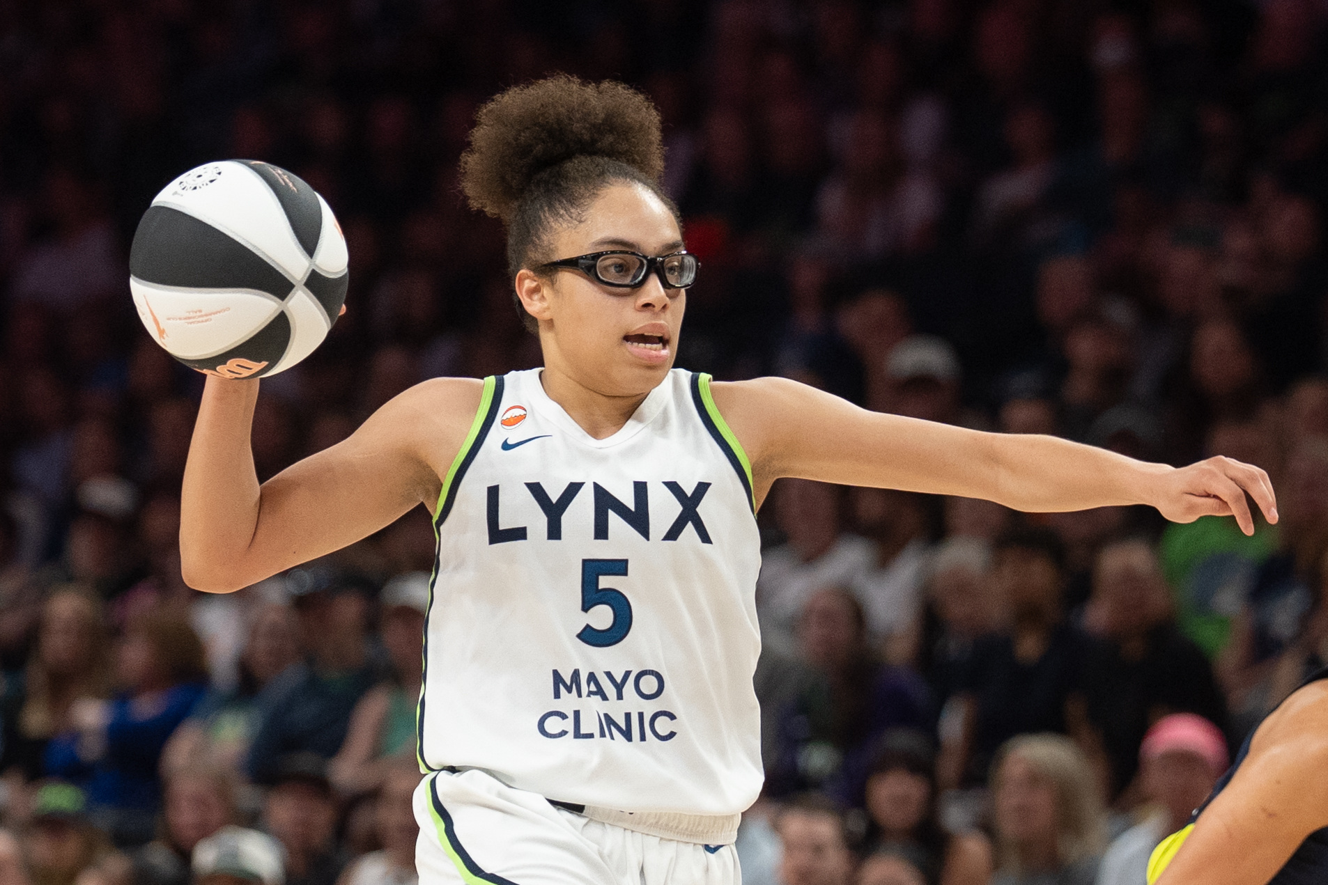 Jun 9, 2026; Minneapolis, Minnesota, USA; Minnesota Lynx guard Olivia Miles (5) gestures while bringing the ball upcourt against Dallas Wings forward Jessica Shepard (32) in the fourth quarter at Target Center.