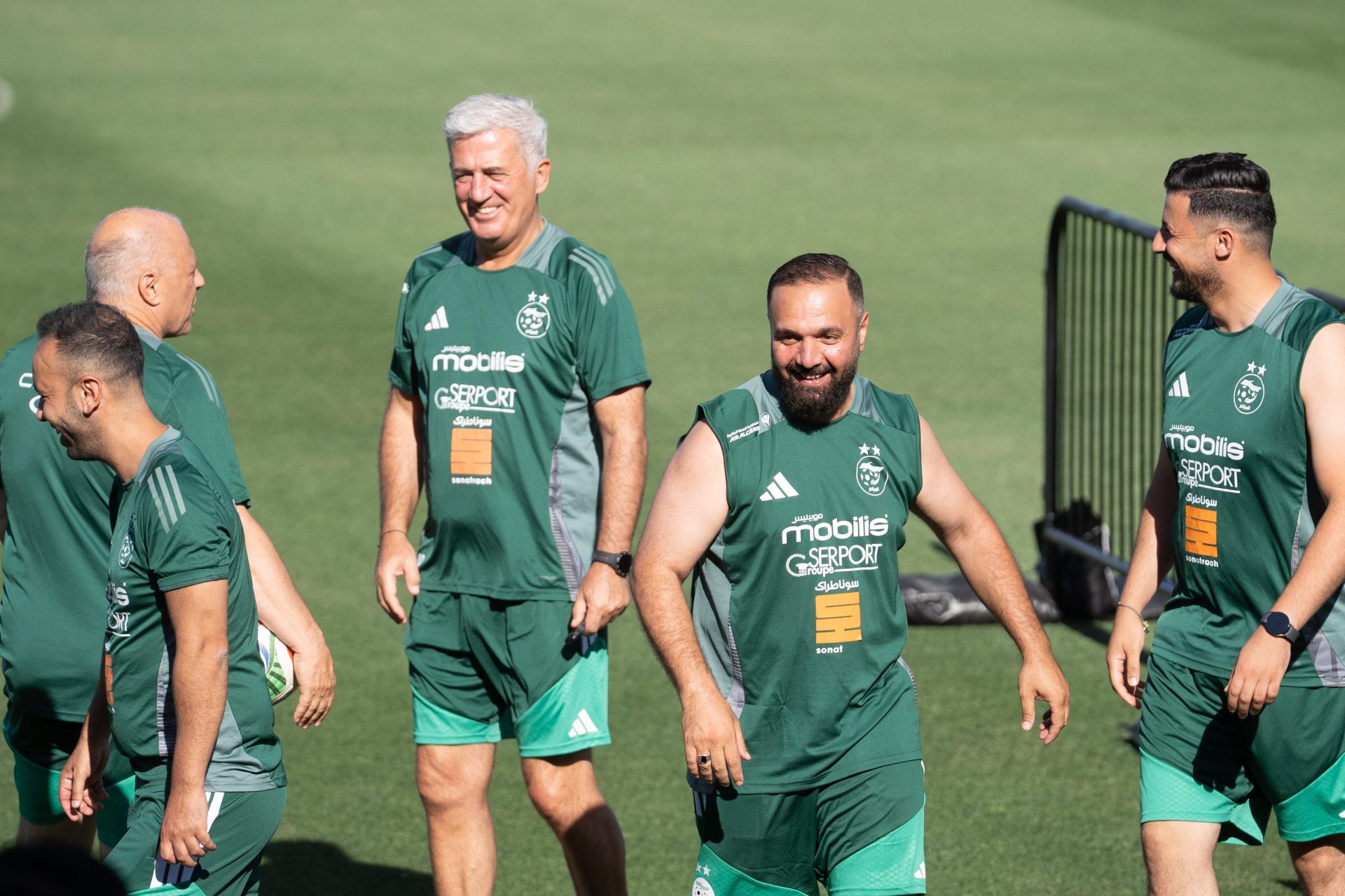 Coaches with the Algerian national team are seen during the Algeria community training session ahead of their World Cup match at Rock Chalk Park on June 11, 2026.