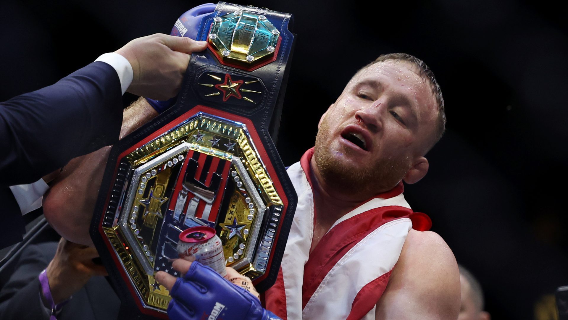 Jun 14, 2026; Washington, D.C., USA; Justin Gaethje (blue gloves) celebrates after winning the UFC Freedom 250 fight against Ilia Topuria (not pictured) at the White House South Lawn. Mandatory Credit: Amber Searls-Imagn Images