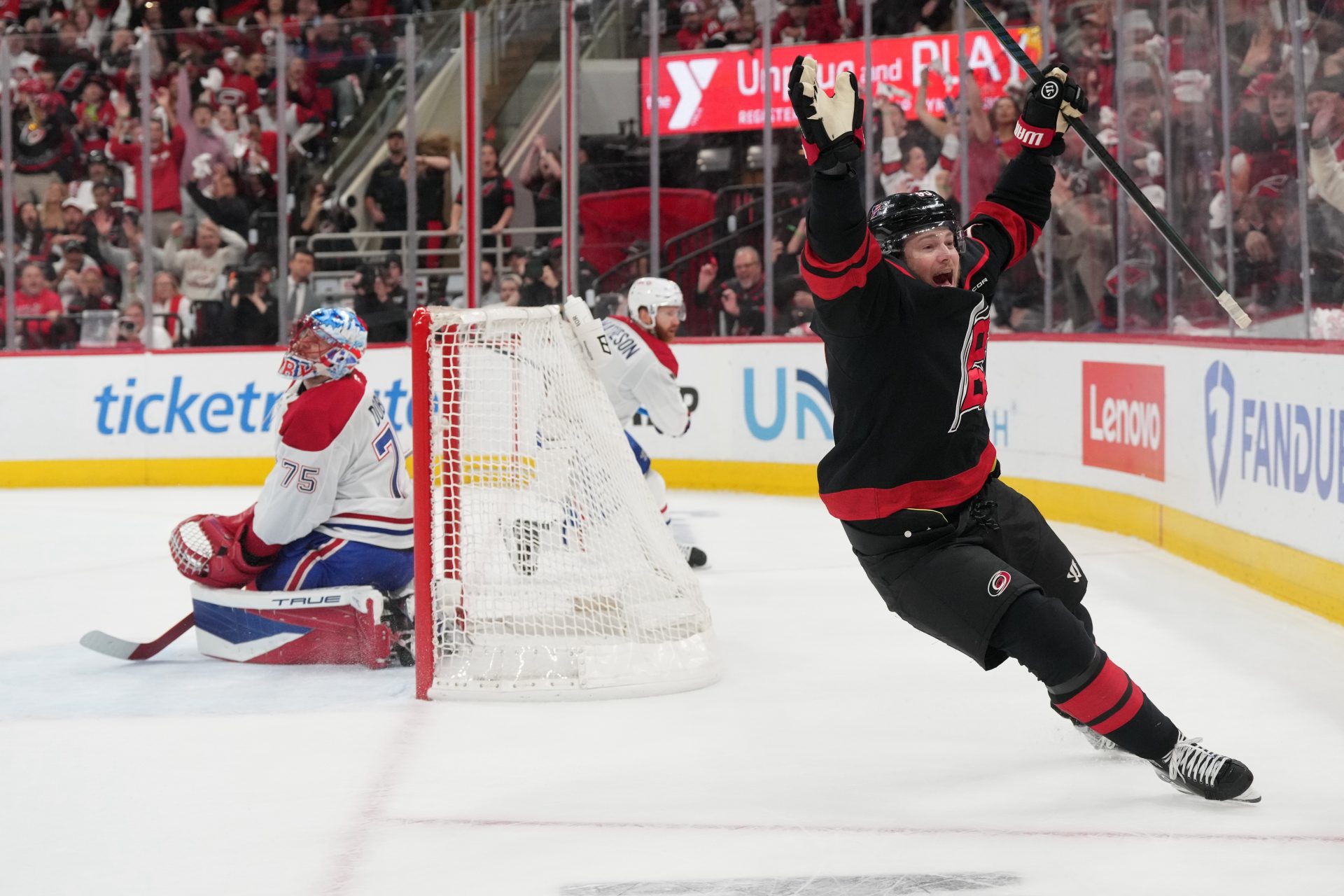 May 29, 2026; Raleigh, North Carolina, USA; Carolina Hurricanes left wing Eric Robinson (50) reacts after scoring an even strength goal against Montreal Canadiens goaltender Jakub Dobes (75) in game five of the Eastern Conference Final of the 2026 Stanley Cup Playoffs during the first period during the first period at Lenovo Center.