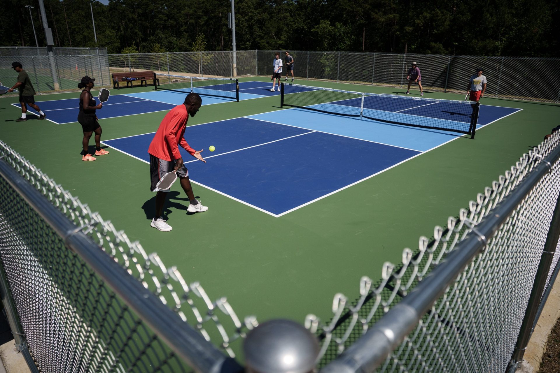 People play pickleball at the grand opening of The Courts at Glenville Lake on Wednesday, June 3, 2026. The facility features 11 tennis courts, including a championship competition court, four pickleball courts, locker rooms, a lounge, learning space and pro shop.