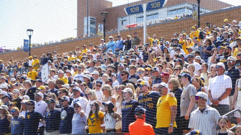 Jun 5, 2026; Morgantown, WV, USA; West Virginia Mountaineers fans sing “Country Roads” after defeating the Cal Poly Mustangs at Kendrick Family Ballpark. Mandatory Credit: Ben Queen-Imagn Images