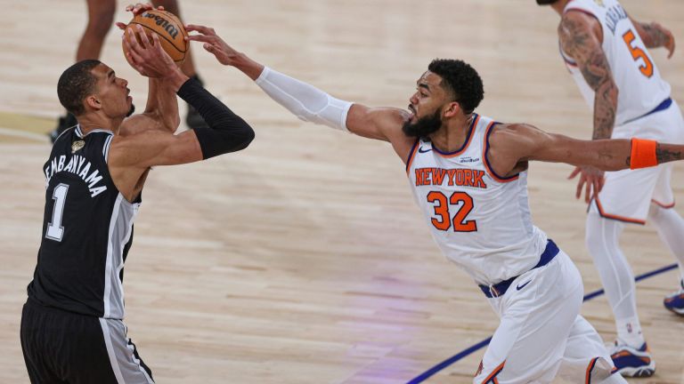 Jun 8, 2026; New York, New York, USA; San Antonio Spurs forward Victor Wembanyama (1) shoots the ball as New York Knicks center Karl-Anthony Towns (32) defends during game three of the 2026 NBA Finals at Madison Square Garden. Mandatory Credit: Vincent Carchietta-Imagn Images